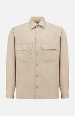 The Structured Lyocell Linen Sport Shirt by RALPH LAUREN PURPLE LABEL is a beige, long-sleeved sport shirt with two chest pockets and a classic collar, crafted in Italy and shown on a plain white background.