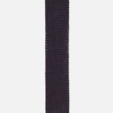 The Superknit Silk Tie by RALPH LAUREN PURPLE LABEL, crafted in Italy, features a dark navy blue hue with a textured knit pattern and is displayed laid flat on a white background.