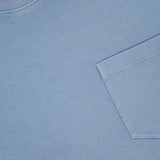 Experience comfort and timeless style in the Vintage Cotton Jersey Short Sleeve T-Shirt from RALPH LAUREN PURPLE LABEL. This light blue crewneck features a soft cotton construction, a classic chest pocket, and a vintage wash for a subtle, lived-in look. The signature purple label inside the collar highlights the brand name and size M.