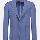 The Ralph Lauren Purple Label Silk Linen Single Breasted Sportcoat features a light blue hue, notch lapels, two patch pockets, a chest pocket, and single-button closure, shown against a plain white background.