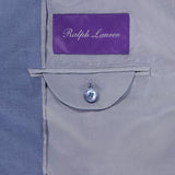 Close-up of the inside of a Silk Linen Single Breasted Sportcoat featuring a Ralph Lauren Purple Label above a small buttoned pocket on a light gray lining.