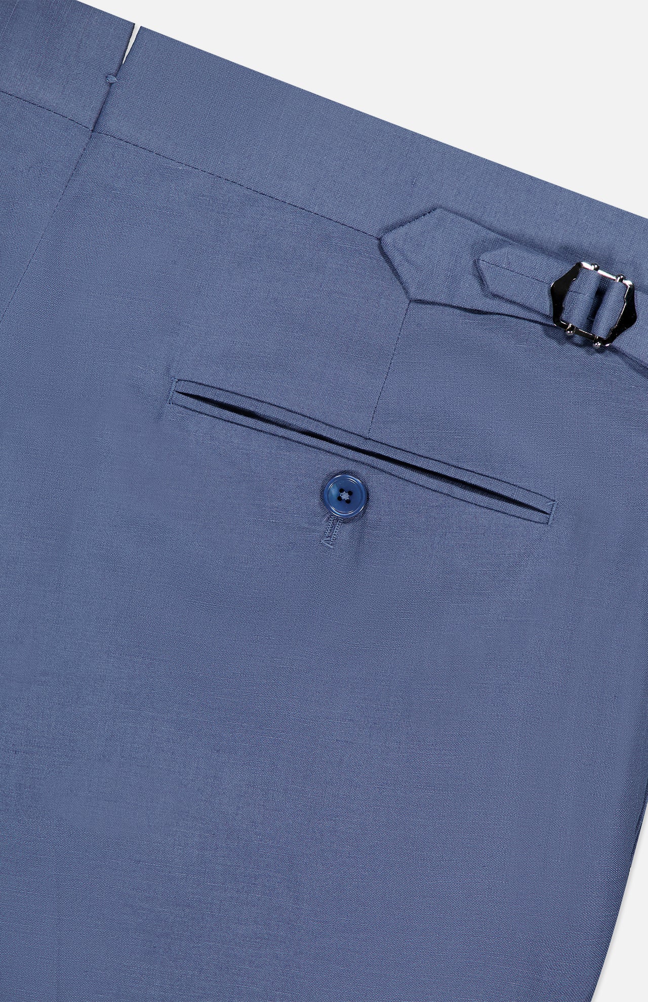 Close-up of the back pocket of Ralph Lauren Purple Label Silk Linen Trouser in light blue, showcasing a single button closure and an adjustable side buckle on the waistband.