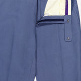 Ralph Lauren Purple Label Silk Linen Trouser in blue, partially unzipped and unbuttoned to reveal the cream inner waistband with purple trim and inner buttons, neatly laid flat on a white background.