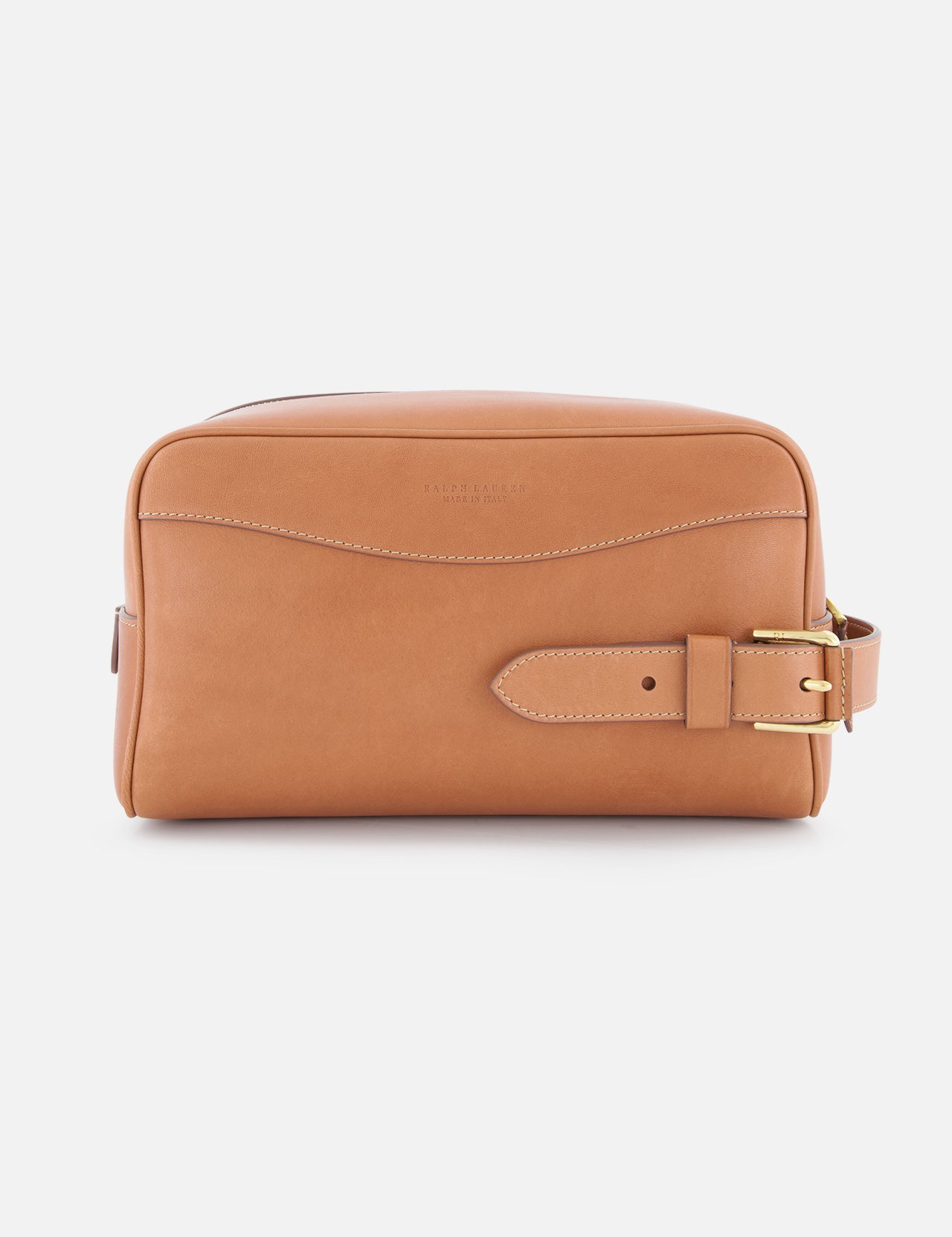The Small Calfskin Saddle Pouch by RALPH LAUREN PURPLE LABEL is a tan leather travel organizer with white stitching, a front seam, and a gold-buckled strap on the right—ideal for men's grooming essentials and shown against a white background.