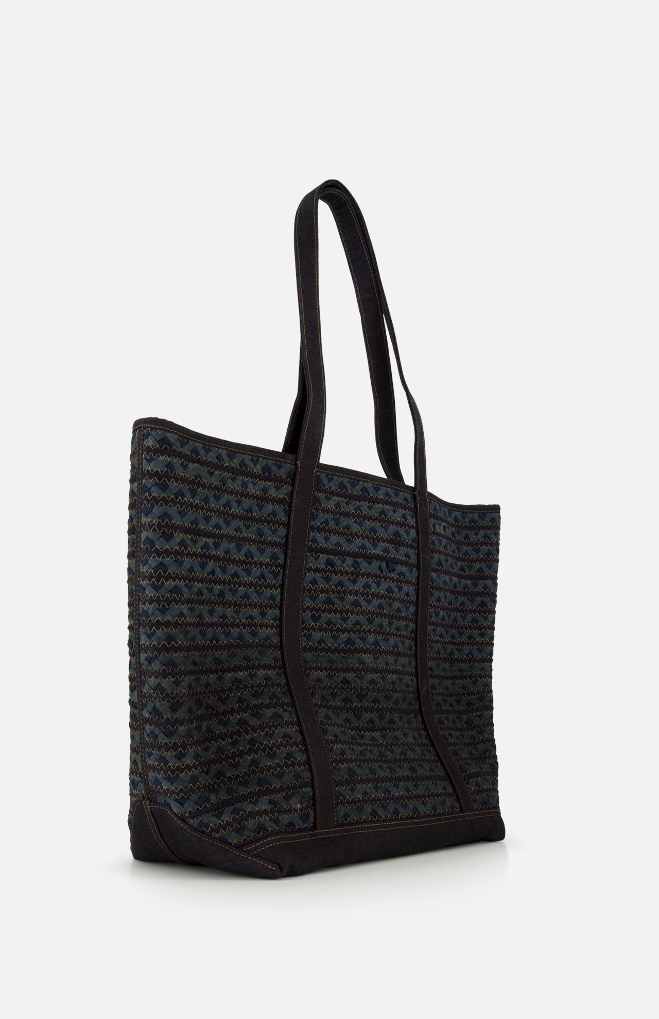 The Cotton Banks Beach Bag by RALPH LAUREN RRL is a large, rectangular navy bag with long black handles and a hand-braided woven pattern in dark blue and black, shown against a plain white background.