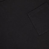 A close-up of the RALPH LAUREN RRL Cotton Jersey Knit Pocket T-Shirt (2 Pack), a black tee with a right chest pocket and visible collar tag, crafted from premium USA-sourced cotton.