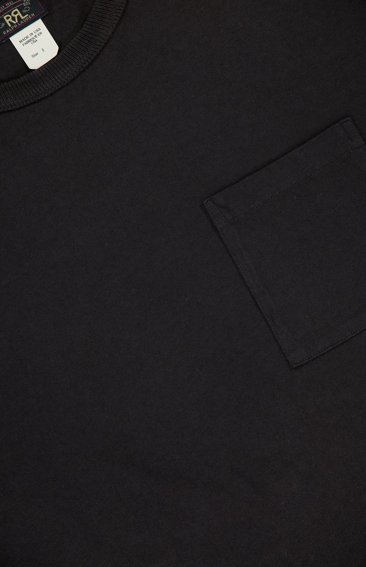 A close-up of the RALPH LAUREN RRL Cotton Jersey Knit Pocket T-Shirt (2 Pack), a black tee with a right chest pocket and visible collar tag, crafted from premium USA-sourced cotton.