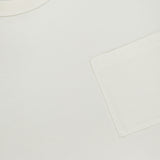 Close-up of a RALPH LAUREN RRL Cotton Jersey Knit Pocket T-Shirt (2 Pack) in vintage white, featuring a right chest pocket and black neckline tag with gold and white text. Made in USA.