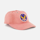 The RALPH LAUREN RRL Cotton Twill Faded Ball Hat is pink with a vintage feel, featuring a round patch of a yellow eagle, three white stars, and "PPL" lettering on blue.