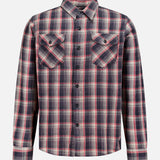 The Jasper Cotton Long Sleeve Workshirt by RALPH LAUREN RRL is a relaxed fit, button-up shirt featuring a red, black, and white plaid pattern. Crafted from durable cotton twill, it includes two chest pockets with flaps and buttons and is displayed on a plain white background.