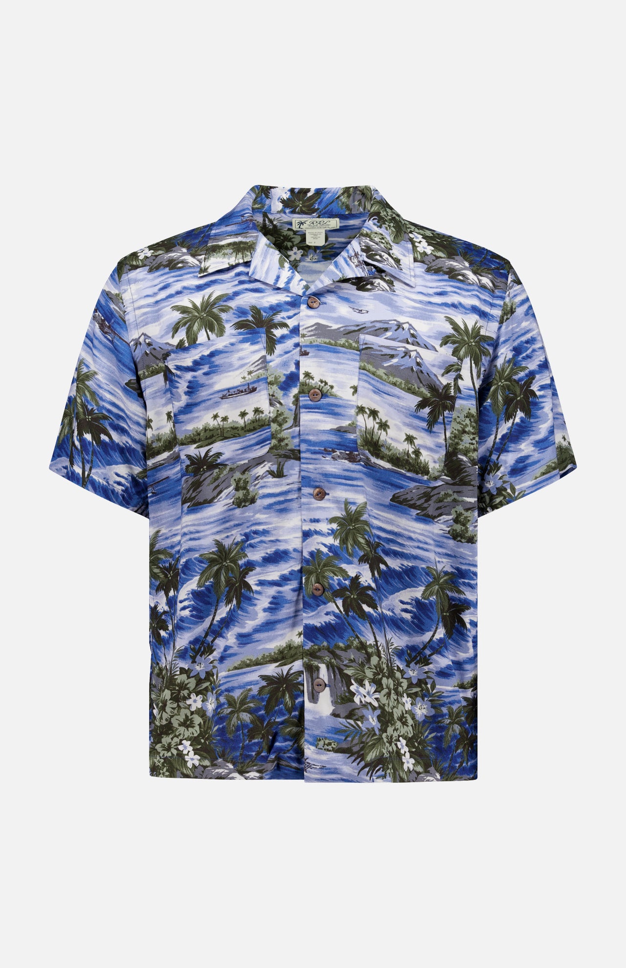 The RALPH LAUREN RRL Rayon 2-Pocket Camp Shirt is a short-sleeved, button-up blue shirt with tropical palm trees, waves, and green foliage motifs printed on lightweight woven fabric.