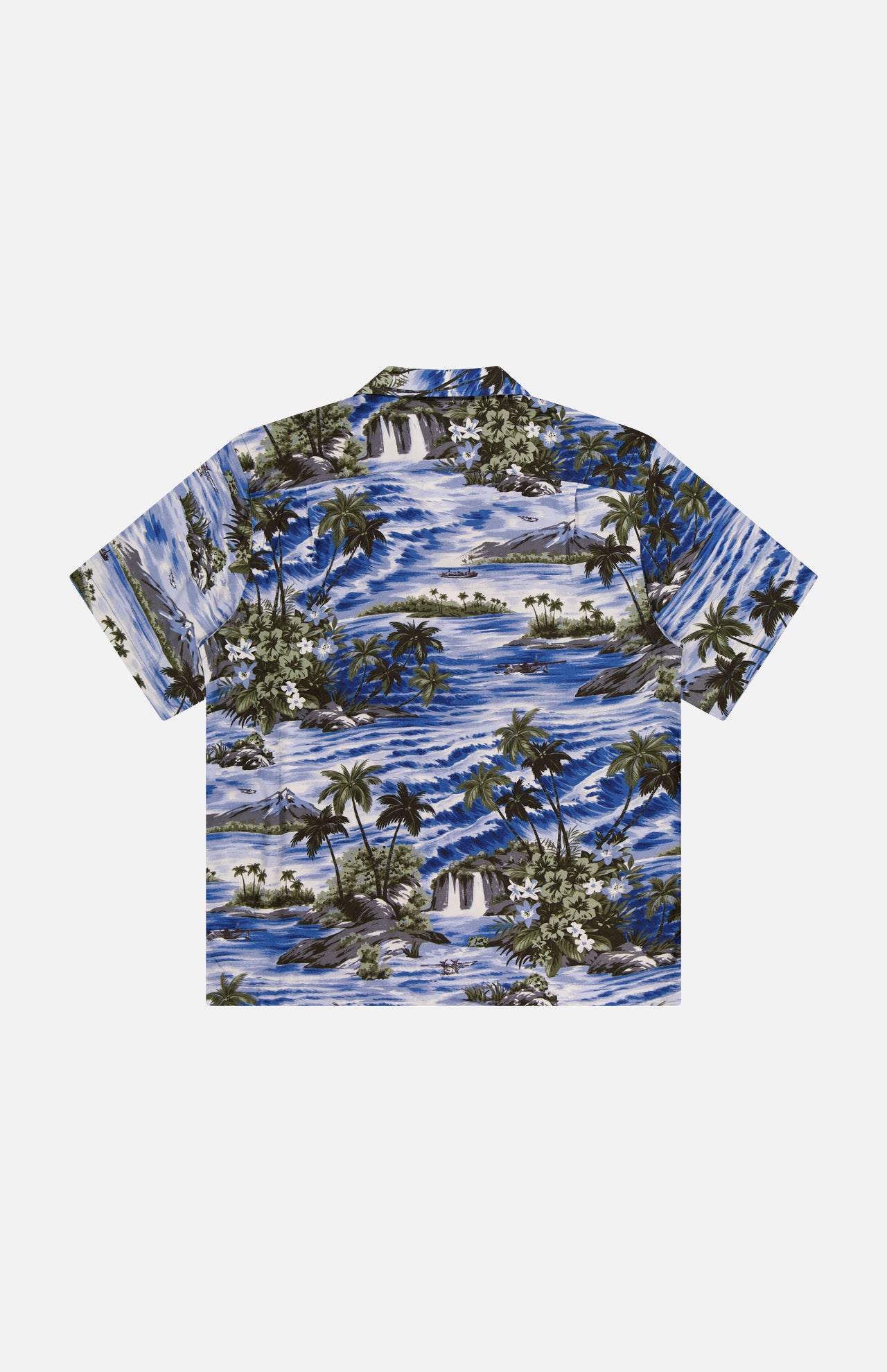 The RALPH LAUREN RRL Rayon 2-Pocket Camp Shirt is a blue, short-sleeve button-up with tropical palm tree and ocean wave motifs, crafted from lightweight woven fabric and shown flat on a white background.