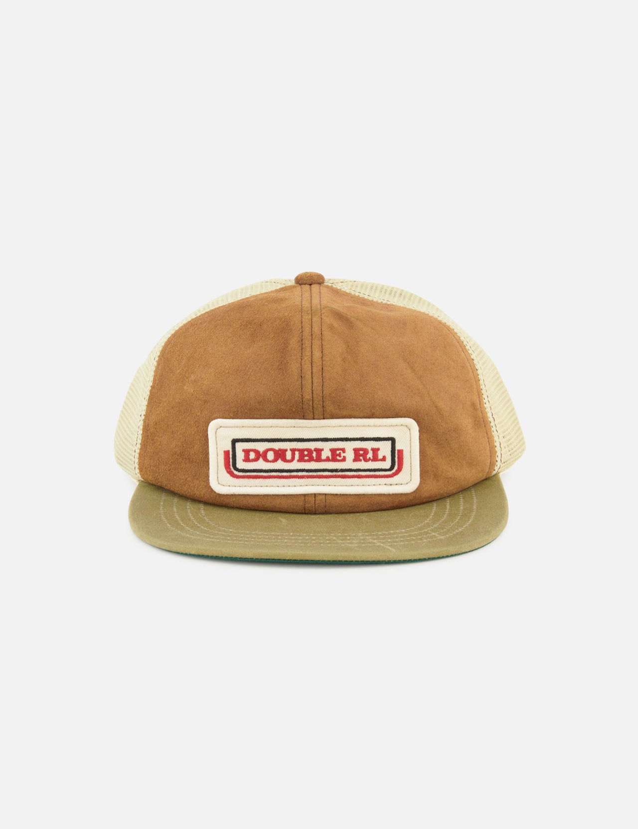 Front view of the Roughout Suede Trucker Cap by RALPH LAUREN RRL in tan and brown suede, featuring a beige mesh back. The front panel displays a rectangular patch with “DOUBLE RL” in red text against a white and brown background, while an adjustable back strap offers a comfortable fit.