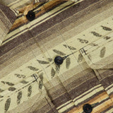 A close-up of the Sportman Cotton Sport Shirt by RALPH LAUREN RRL, featuring earthy-toned striped brushed cotton twill, leaf-like patterns, dark buttons, and a visible pocket.