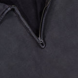 Close-up of the Terry Quarter Zip Pullover Sweatshirt by RALPH LAUREN RRL, featuring a dark fabric with a partially unzipped metal zipper reminiscent of a classic quarter zip design, revealing the inner lining and an RRL Ralph Lauren label in the upper left corner.