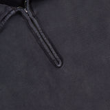 Close-up of the Terry Quarter Zip Pullover Sweatshirt from RALPH LAUREN RRL in dark gray, featuring a smooth yet slightly textured fabric. The shirt’s collar showcases a short zipper that is partially open, evoking the timeless look of a classic quarter zip style. Inside the collar, you'll find an RR and Ralph Lauren label—making this pullover an ideal choice for stylish comfort during travel.