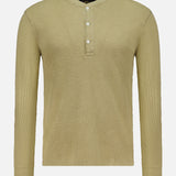The RALPH LAUREN RRL Waffle Knit Long Sleeve Henley Shirt is shown in a light olive green color, featuring a waffle-knit texture, long sleeves, and a short button placket with three vintage-inspired buttons, displayed against a plain white background.