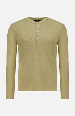 The RALPH LAUREN RRL Waffle Knit Long Sleeve Henley Shirt is shown in a light olive green color, featuring a waffle-knit texture, long sleeves, and a short button placket with three vintage-inspired buttons, displayed against a plain white background.