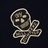 RALPH LAUREN RRL Wool Long Sleeve Crewneck Sweater in navy, featuring an embroidered skull and crossbones patch with NY on the forehead and HILL CLIMBERS on the crossbones.