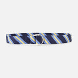 The Buckley Ribbon Belt by ROBERT TALBOTT is crafted in Italy from premium fabric and features a navy blue base with diagonal yellow, blue, and white stripes. It has a silver double-ring buckle and is displayed against a plain white background.