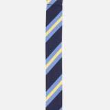 Introducing the Buckley Ribbon Belt by ROBERT TALBOTT, elegantly crafted in Italy. This belt features a navy blue base with light blue and yellow stripes, complemented by a polished metal ring buckle at the top.