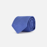 The Duvall Grenadine Unlined Tie by ROBERT TALBOTT, featuring a textured blue silk design, is shown rolled up on a plain white background.