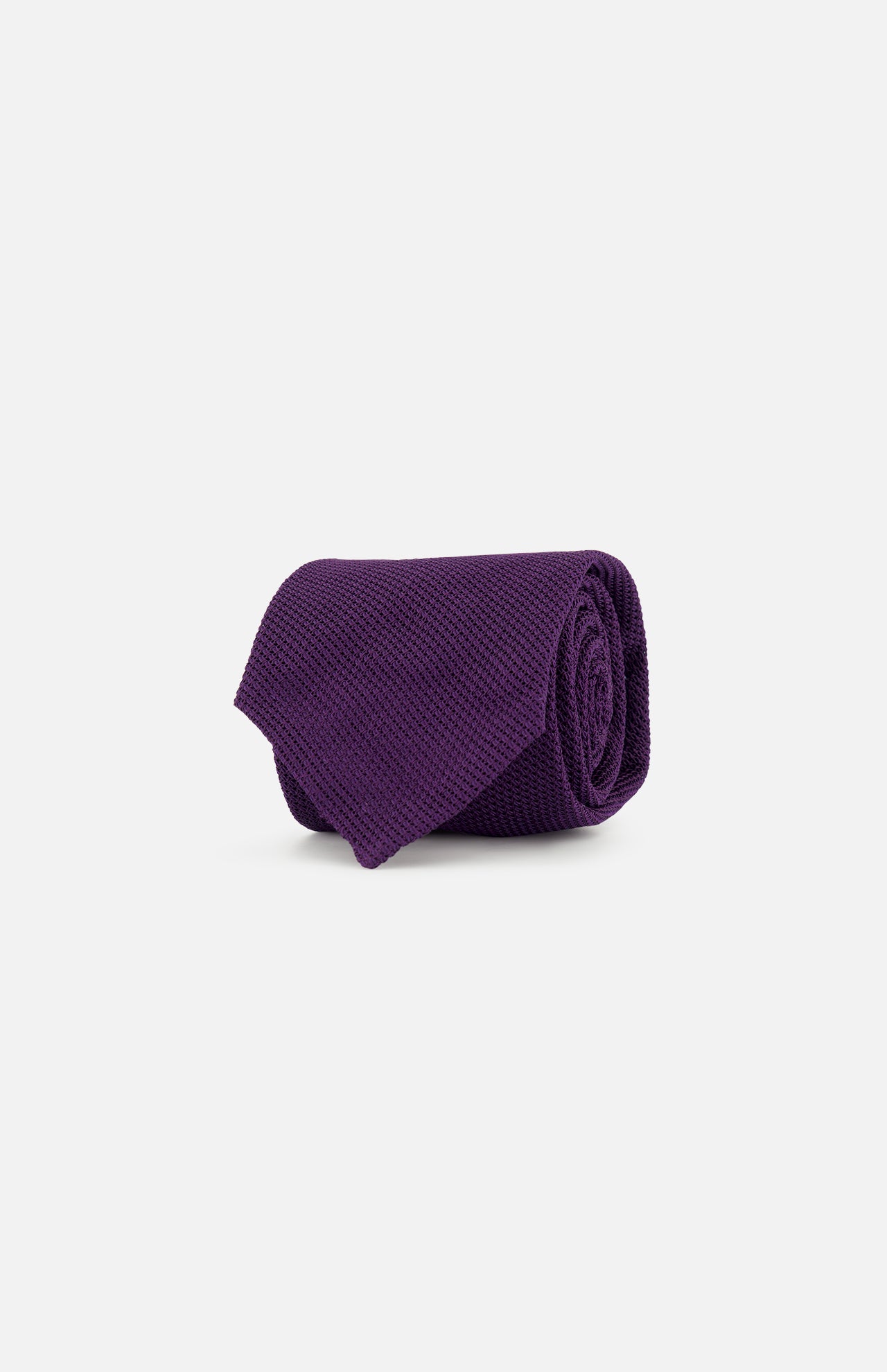 The Duvall Grenadine Unlined Tie by ROBERT TALBOTT is shown rolled up on a plain, light gray background.