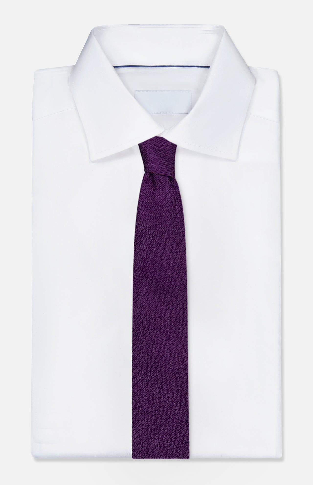 A crisp white dress shirt with a pointed collar is paired with the Duvall Grenadine Unlined Tie by ROBERT TALBOTT, shown against a plain light background.