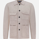 The ROBERT TALBOTT Landon Sweater Jacket is a light beige, long-sleeve hybrid sweater-jacket featuring a collar, black buttons, and four front pockets. Crafted in a tailored fit from premium Merino wool, it is displayed on a plain white background.