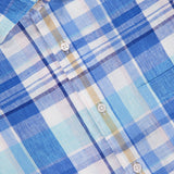 Close-up of the ROBERT TALBOTT Morgan Short Sleeve Plaid Linen Shirt in blue, white, and light brown with white buttons and a chest pocket; collar label shows ROBERT TALBOTT.