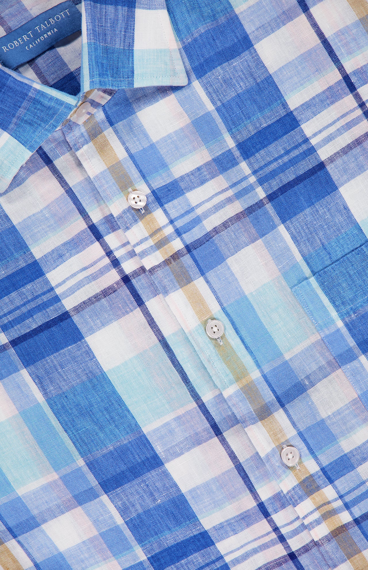 Close-up of the ROBERT TALBOTT Morgan Short Sleeve Plaid Linen Shirt in blue, white, and light brown with white buttons and a chest pocket; collar label shows ROBERT TALBOTT.