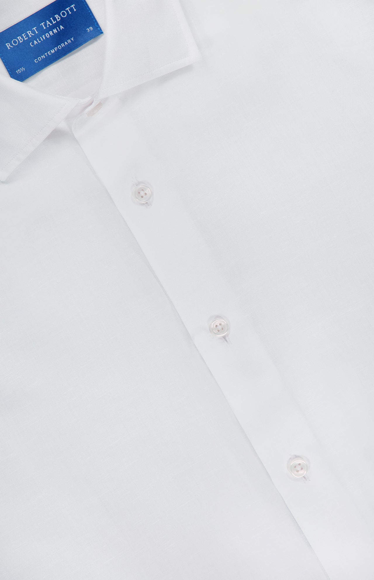 Close-up of a white ROBERT TALBOTT Reynolds Contemporary Cotton Linen Dress Shirt with a blue label inside the collar. This shirt features white buttons, a classic collar, and is ideal for business casual style.