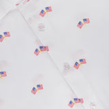 Close-up of the Reynolds Flag Coupe Twill Dress Shirt by ROBERT TALBOTT, a white sport shirt with a small American flag print and a collar showcasing the blue Robert Talbott California label. Ideal for everyday wear.