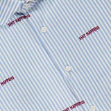 Introducing the Reynolds Novelty Embroidery Bengal Dress Shirt by ROBERT TALBOTT: expertly crafted from premium Italian fabric, this blue and white striped button-up shirt features the phrase “SHIT HAPPENS” repeatedly embroidered in bold red text—a standout piece in men’s fashion.