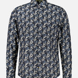 The Reynolds Printed Cow Hide Dress Shirt by ROBERT TALBOTT is a long-sleeve, button-up dark navy dress shirt featuring a blue, white, and black abstract floral pattern. It is crafted from a luxurious Italian silk cotton-blend fabric and is displayed against a plain white background.