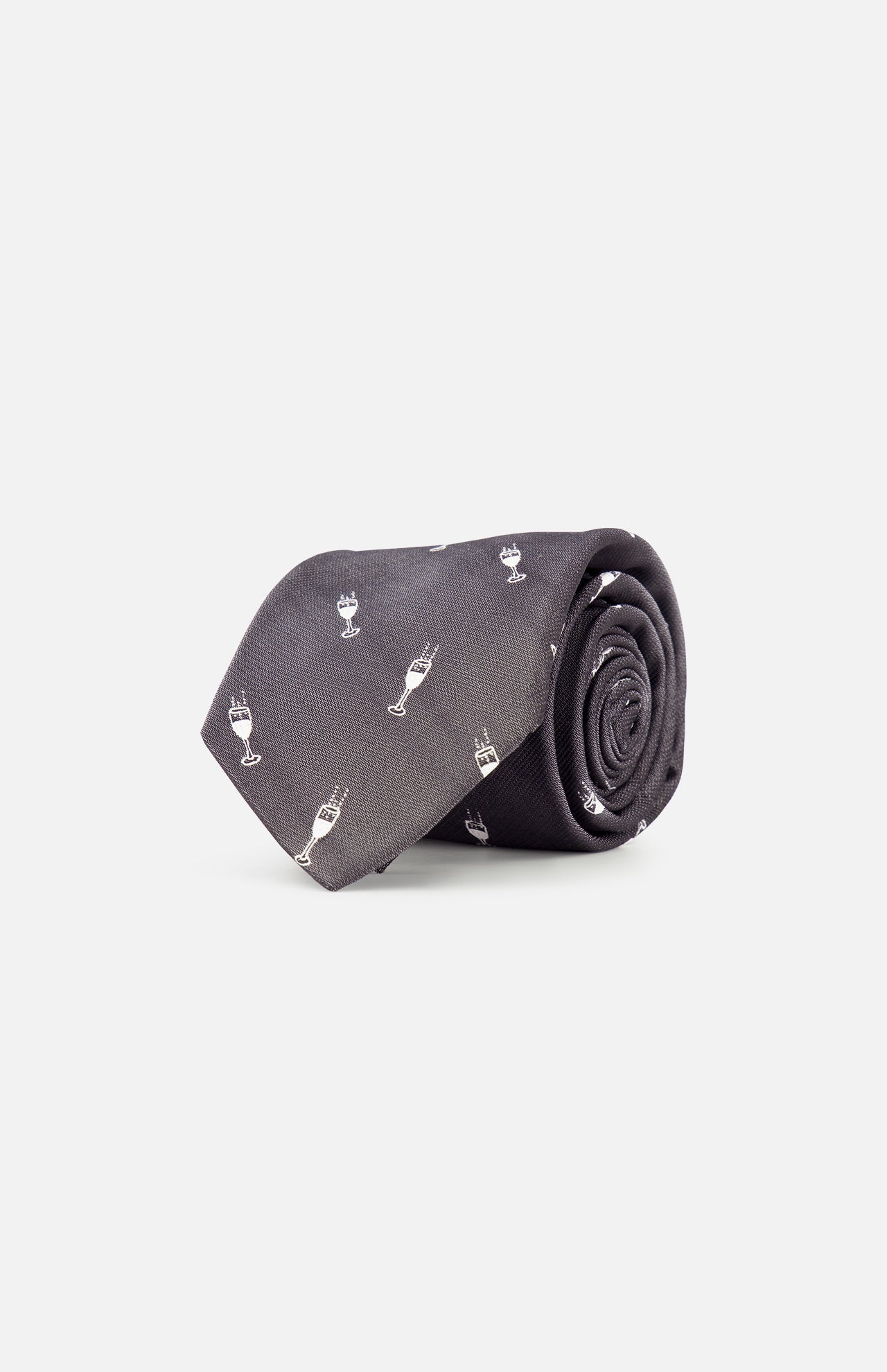 The ROBERT TALBOTT Robert Champagne Glass Tie, in dark grey silk and featuring a subtle pattern of small white champagne glass icons, is shown rolled up on a plain white background.