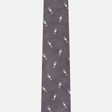 Introducing the Robert Champagne Glass Tie by ROBERT TALBOTT—this dark grey silk tie showcases a repeating pattern of small, white champagne glasses and is presented against a plain white background.