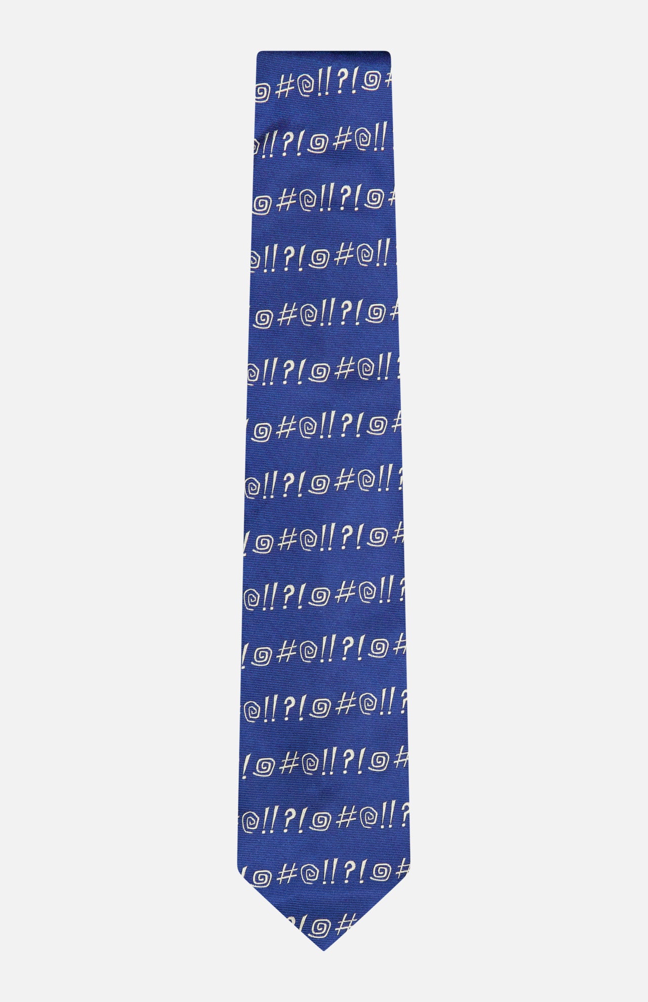 Discover the Robert Grawlix Tie by ROBERT TALBOTT—a luxurious blue silk necktie adorned with a playful grawlix print of white cartoon symbols, including exclamation marks, question marks, pound signs, and spirals, artfully arranged in orderly rows for a sophisticated yet whimsical statement.