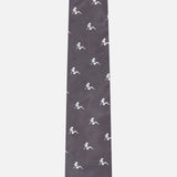 The Robert Pin-Up Silhouette Tie by ROBERT TALBOTT is a dark grey silk designer necktie adorned with a repeating white pattern of small dinosaur silhouettes, bringing a playful yet sophisticated accent to any outfit.