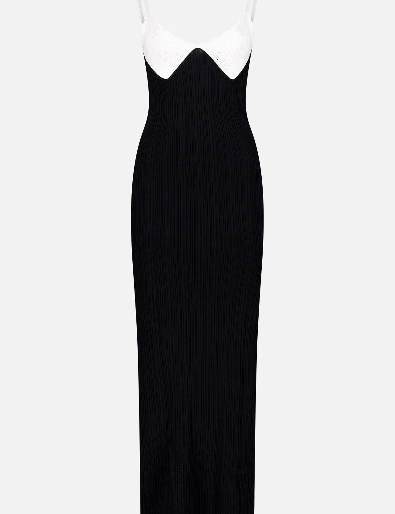 The Amber Contrast Knit Maxi Dress by RONNY KOBO is a sleeveless, form-fitting black maxi dress with thin white straps, a white sweetheart neckline, and contrast trim details, shown against a plain light background.