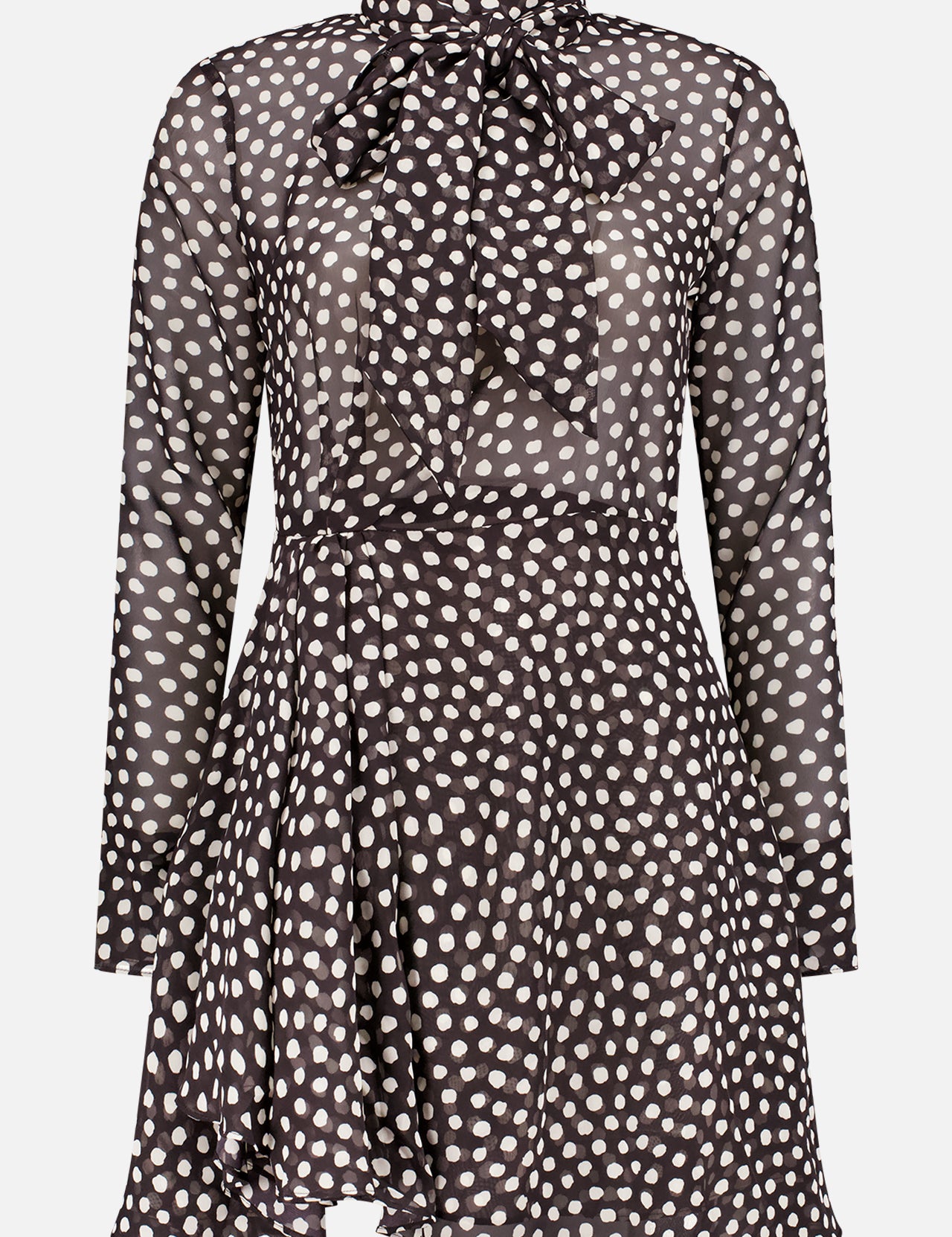 The Carlotta Dress by RONNY KOBO features a vintage-inspired black and white polka dot design, long sleeves, high neckline with a large bow tie, sheer fabric, and an asymmetrical hem.