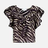 The Aubrey Zebra Print Ruffle Top by RONNY KOBO is a short-sleeved, sheer black and beige top featuring zebra stripes, ruffle details at the neckline and shoulders, and a chic front tie.