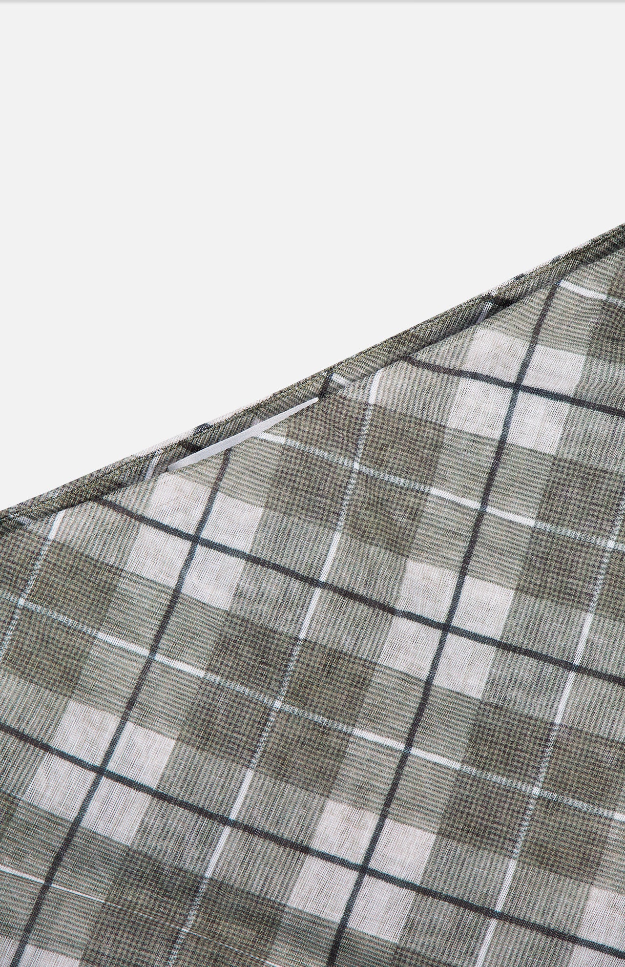 A close-up of the Azana Mesh Plaid Skirt by RONNY KOBO, showcasing its gray, green, and white checkered pattern diagonally on a white background—ideal for elevating your office style.