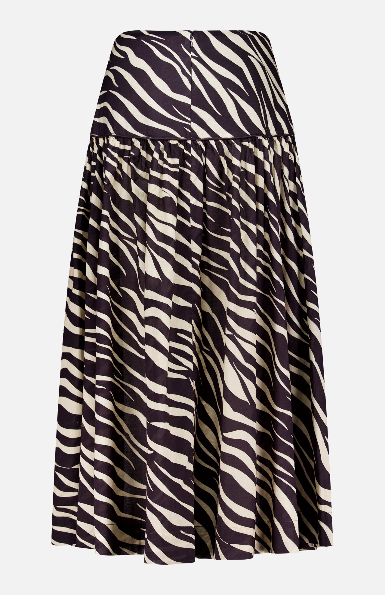 The Feyre Animal Print Skirt by RONNY KOBO features bold black and white zebra stripes, a knee-length gathered flared silhouette, and a fitted waistband for a striking animal print look.