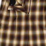The Hayes Plaid Straight Leg Pant by RONNY KOBO features brown, yellow, and beige plaid with a soft gradient check pattern. Partially open at the waistband and fly to reveal the inside button and zipper closure, these tailored trousers offer a straight-leg silhouette for a timeless look.