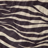 The Krisa Zebra Column Dress by RONNY KOBO features a black and white zebra stripe pattern with diagonal and wavy lines, creating an abstract animal print design—perfect for making a statement in this chic sleeveless maxi dress.