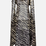 The RONNY KOBO Kyle Zebra Print Maxi Top features a long-sleeve sheer silhouette with a black and beige zebra print pattern, ruffled neckline, and dramatic bell sleeves, channeling the elegance of classic animal-inspired design.