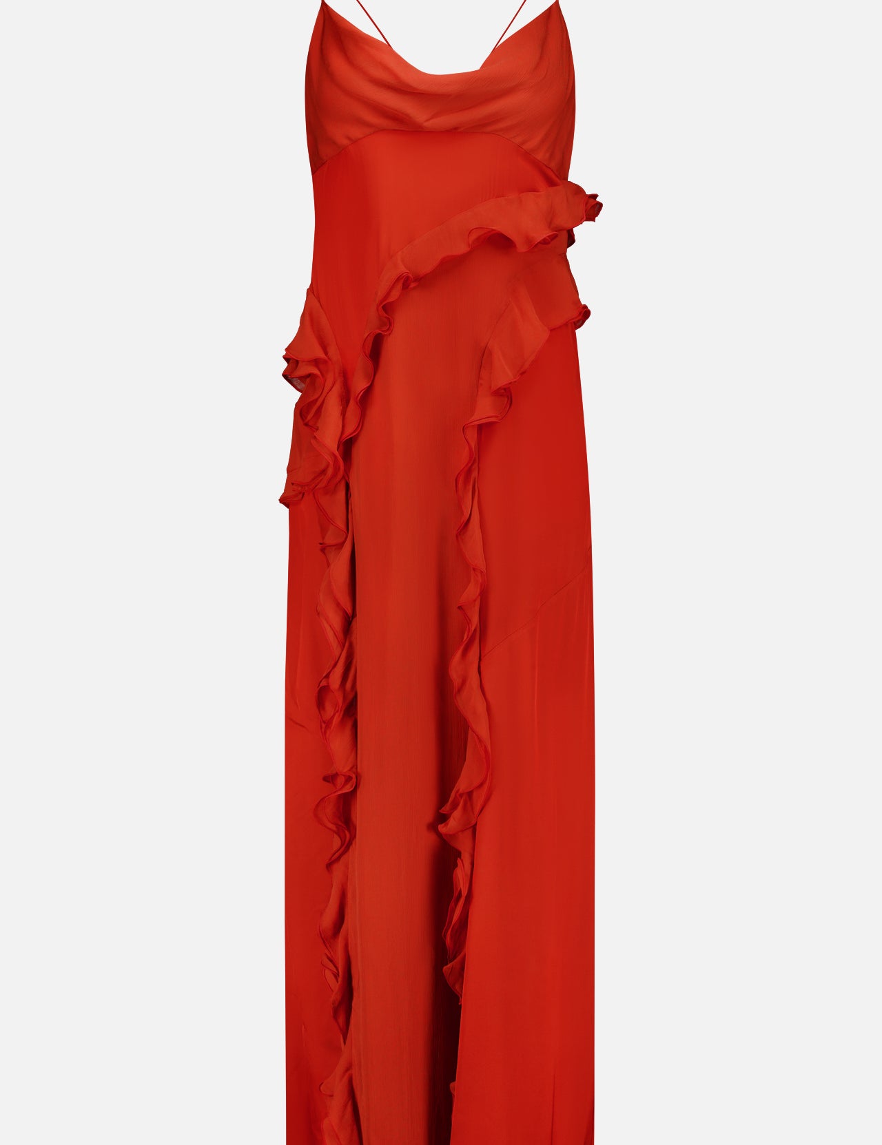 The Milena Draping Maxi Dress by RONNY KOBO is a sleeveless, vibrant red dress with thin spaghetti straps, showcasing fluid draping and a ruffled detail that cascades diagonally from the waist to the hem. It features a subtle thigh-high slit for an added touch of elegance.
