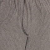 Close-up of the RONNY KOBO Moni Stripe Pull-on Pant in grey, showcasing a subtle pinstripe pattern, elasticized waistline, and gathered fabric at the top.