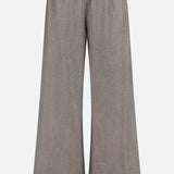 The Moni Stripe Pull-on Pant by RONNY KOBO features a wide-leg silhouette and an elasticized waistline, crafted from a lightweight, textured fabric in grey. These loose-fitting pants fall straight to the floor and are shown against a plain white background.